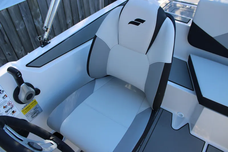 Slide: The Image of 2026 Starcraft SV 18 OB boat interior with sleek, modern seating and control panel. - 12
