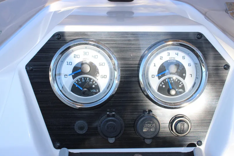 Slide: The Image of Dashboard of 2026 Starcraft SV 18 OB boat with speedometer and fuel gauge. - 14