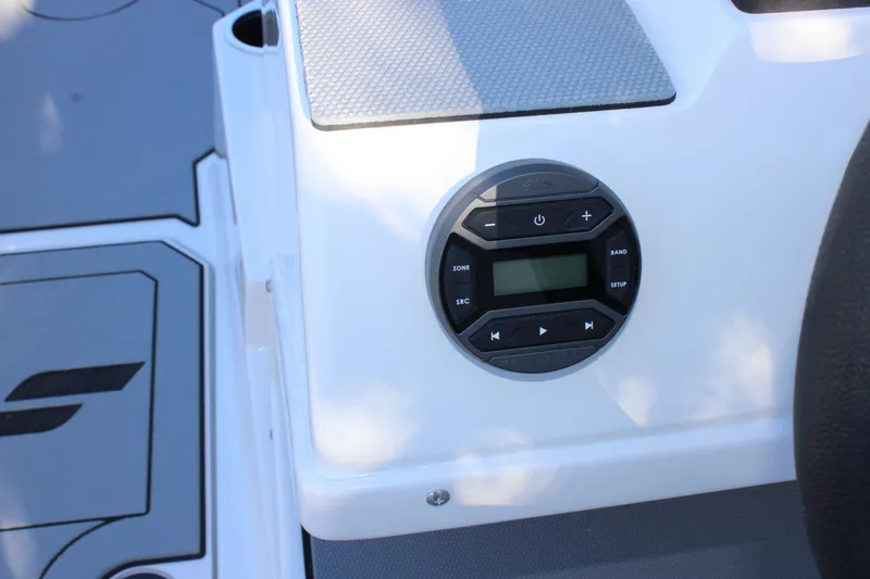 Slide: The Image of 2026 Starcraft SV 18 OB boat dashboard with audio control panel. - 16