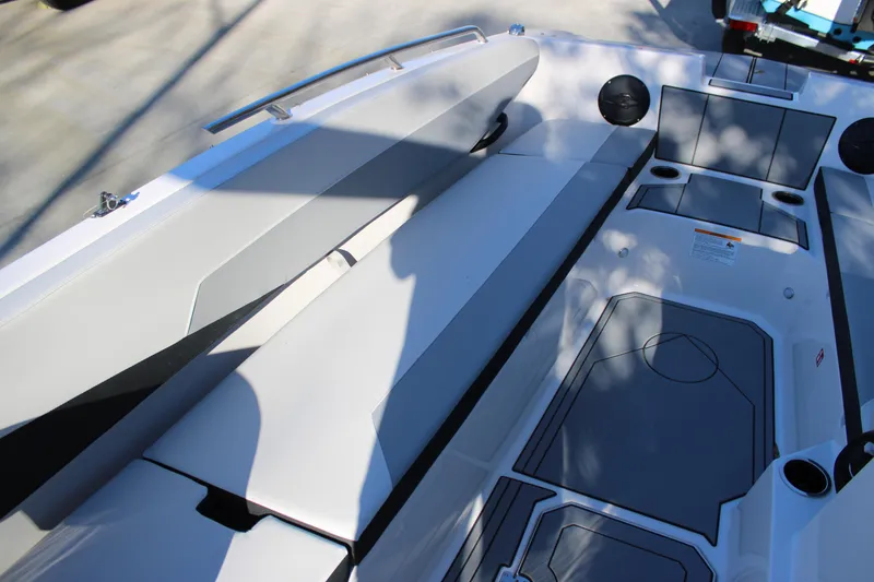 Slide: The Image of 2026 Starcraft SV 18 OB boat interior with seating and storage compartments. - 20