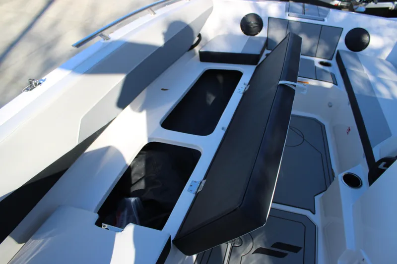 Slide: The Image of 2026 Starcraft SV 18 OB boat interior with open storage compartments and seating. - 22