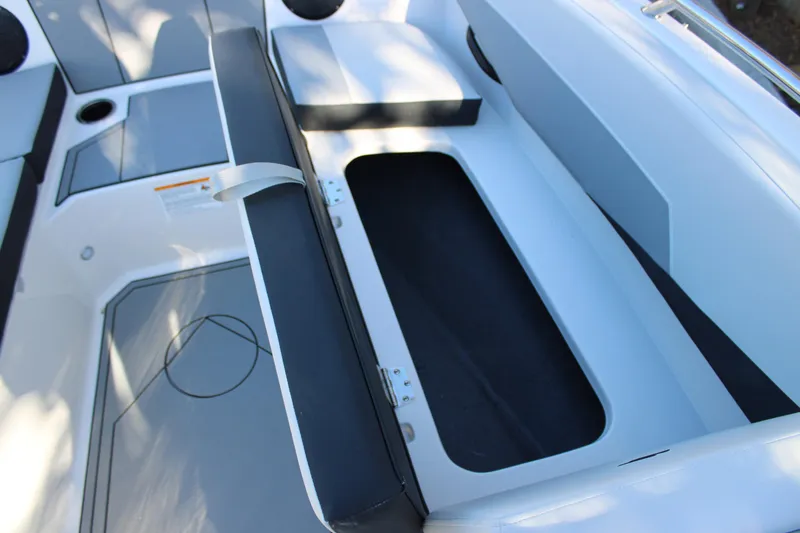 Slide: The Image of Open storage compartment in 2026 Starcraft SV 18 OB boat interior. - 24