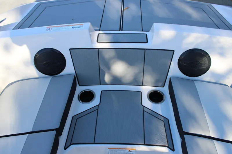 Slide: The Image of 2026 Starcraft SV 18 OB boat interior with speakers and cup holders. - 25