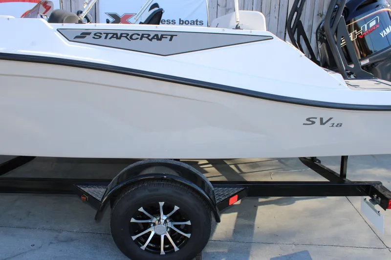 Slide: The Image of 2026 Starcraft SV 18 OB boat on trailer, side view. - 28