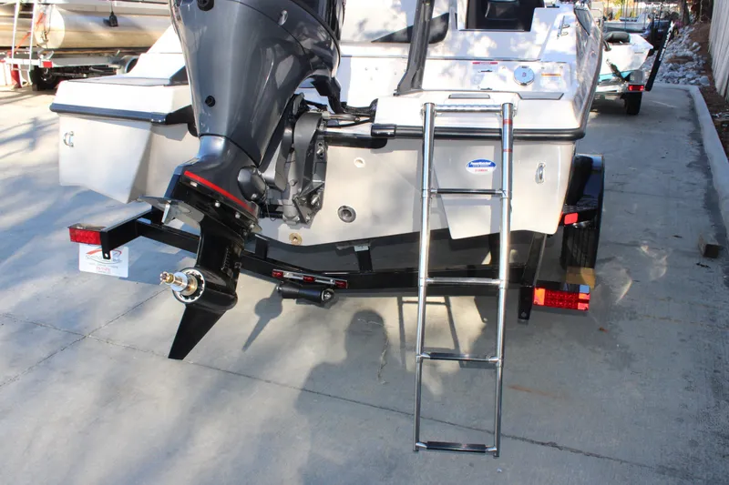 Slide: The Image of 2026 Starcraft SV 18 OB boat rear view with motor and ladder. - 6