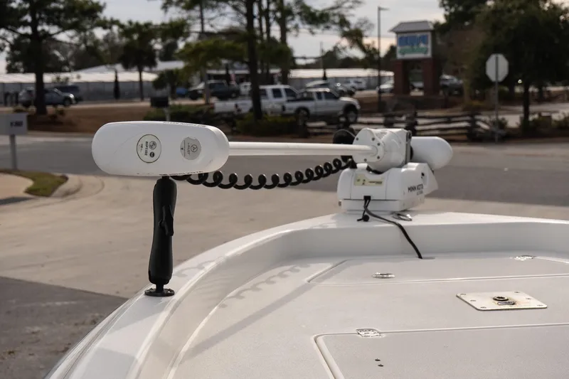 Slide: The Image of 2021 ShearWater 25LTD boat with Minn Kota trolling motor in a parking area. - 21