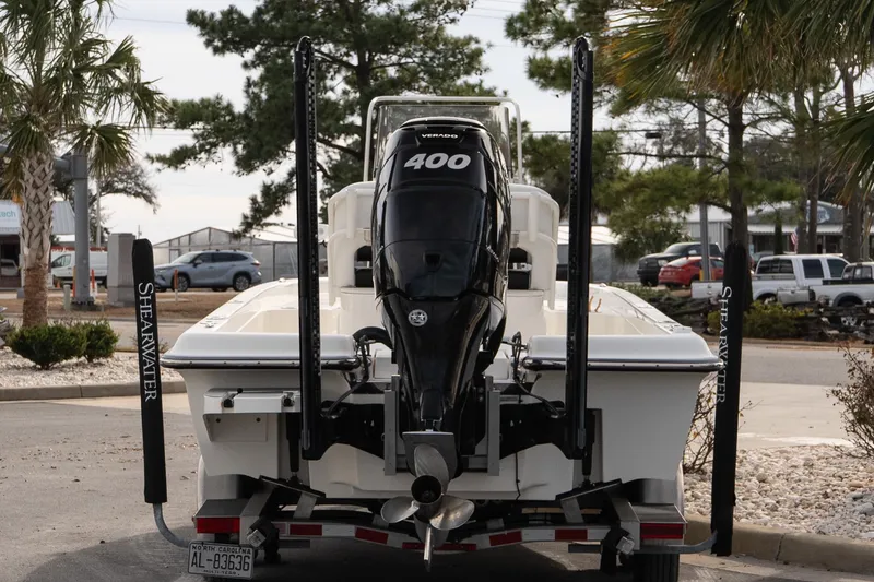 Slide: The Image of 2021 ShearWater 25LTD boat with powerful 400 Verado engine, parked outdoors. - 5