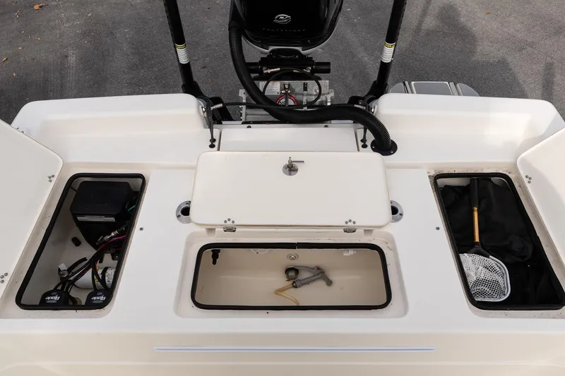 Slide: The Image of 2021 ShearWater 25LTD boat deck with storage compartments and equipment. - 9