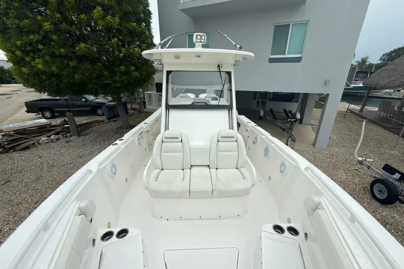 Slide: The Image of 2016 Everglades 295 Center Console boat with white seating and spacious deck. - 20