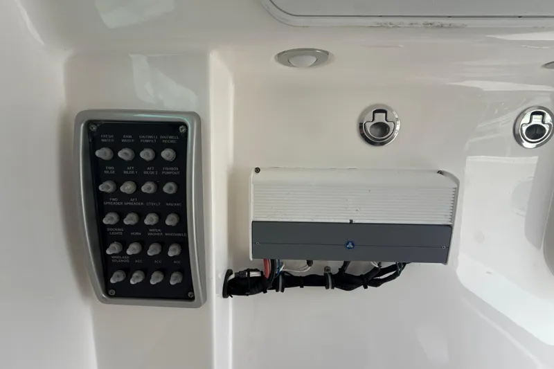 Slide: The Image of Control panel and equipment on a 2016 Everglades 295 Center Console boat. - 23