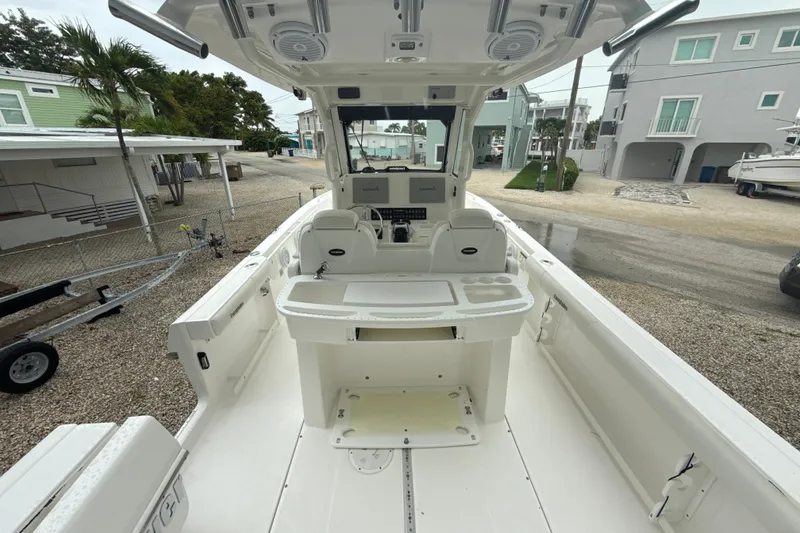 Slide: The Image of 2016 Everglades 295 Center Console boat interior with helm and seating area. - 8