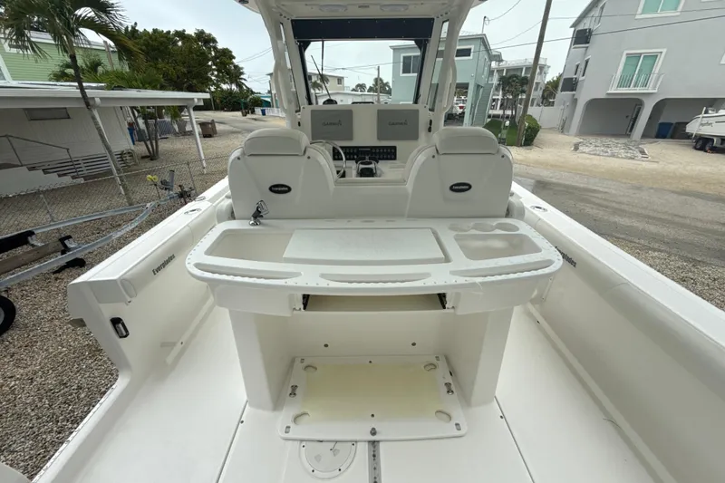 Slide: The Image of 2016 Everglades 295 Center Console boat interior with helm and seating area. - 9