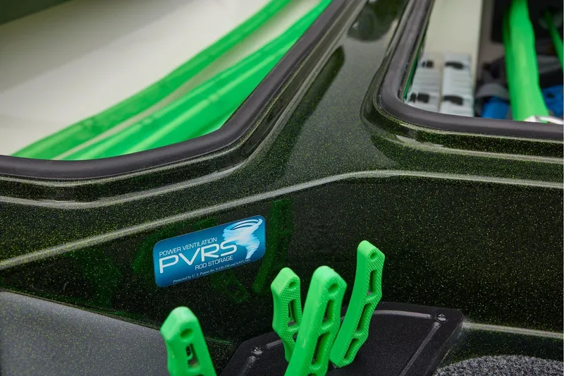 Slide: The Image of 2026 Ranger Z521 boat interior with steering wheel and green-accented seat. - 26