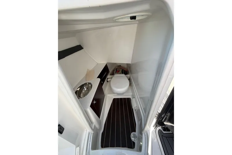 Slide: The Image of 2017 Monterey 298SS Super Sport boat interior bathroom with toilet and sink. - 20