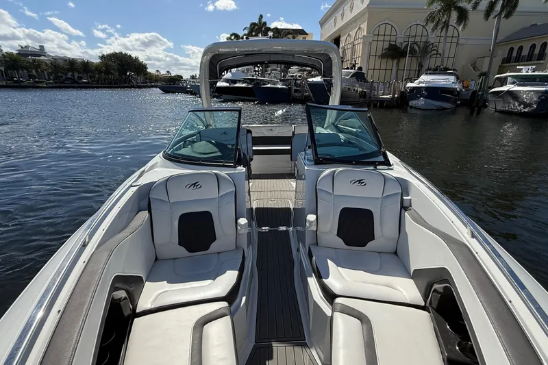 Slide: The Image of 2017 Monterey 298SS Super Sport boat interior with luxurious seating on a sunny day. - 21