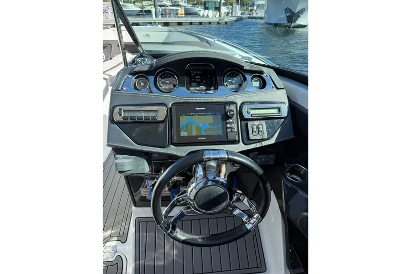 Slide: The Image of Dashboard of a 2017 Monterey 298SS Super Sport boat with navigation system. - 27