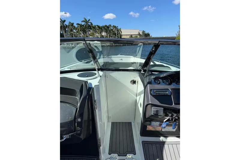 Slide: The Image of 2017 Monterey 298SS Super Sport boat interior with open windshield, dashboard, and water view. - 31