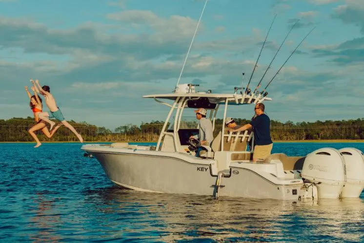 The Image of 2026 Key West 219 FS boat on trailer in snowy outdoor setting. - 0