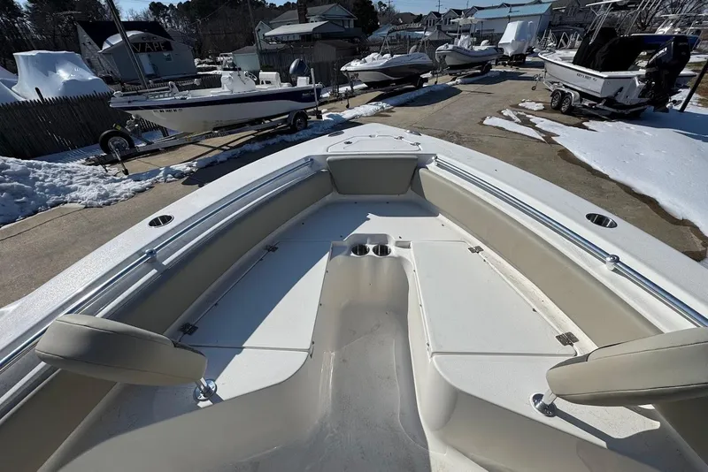 Slide: The Image of 2026 Key West 219 FS boat in snowy outdoor setting, showcasing spacious seating and storage. - 10