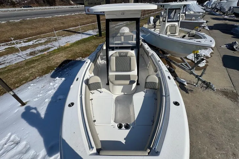 Slide: The Image of 2026 Key West 219 FS boat on display in snowy outdoor setting. - 13