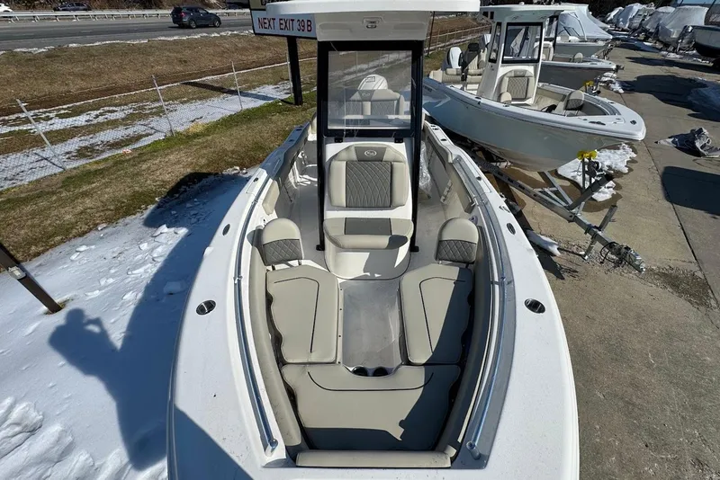 Slide: The Image of 2026 Key West 219 FS boat with sleek seating, parked on snowy ground. - 16