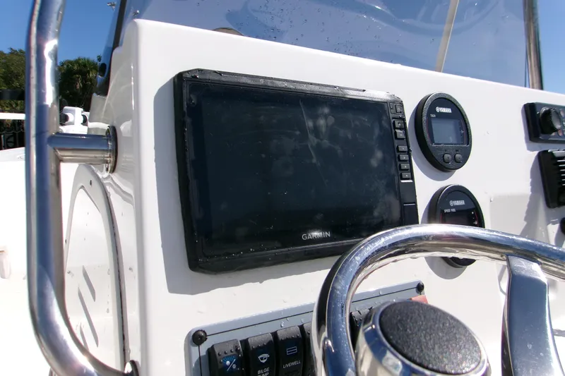 Slide: The Image of 2021 Key West 189 FS boat dashboard with Garmin navigation system and Yamaha gauges. - 10