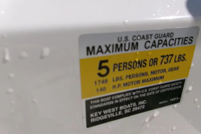Slide: The Image of 2021 Key West 189 FS boat capacity label, 5 persons or 737 lbs maximum. - 12