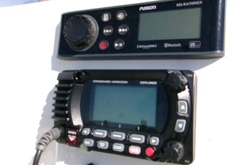 Slide: The Image of Boat dashboard with Fusion MS-RA70NSX stereo and Standard Horizon Explorer radio, Key West 189 FS 2021. - 6