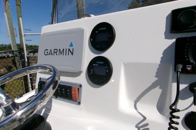 Slide: The Image of 2021 Key West 189 FS boat dashboard with Garmin and Yamaha displays. - 7
