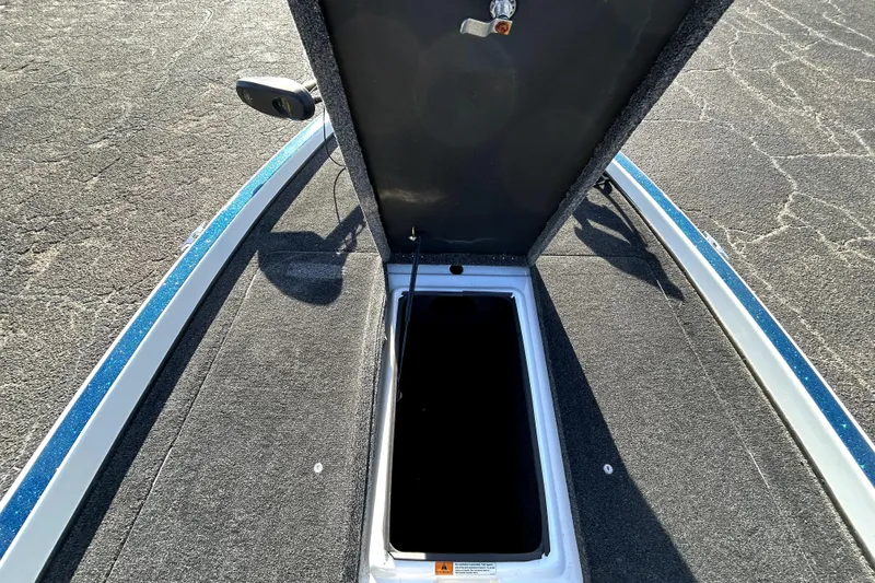 Slide: The Image of Open storage compartment on 2003 Champion 187 CX boat deck. - 13
