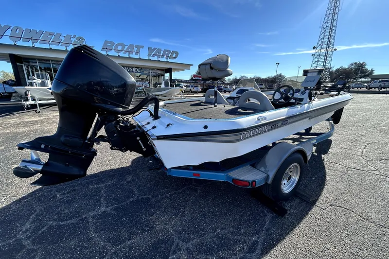 Slide: The Image of 2003 Champion 187 CX boat on trailer at Howell's Boat Yard. - 6