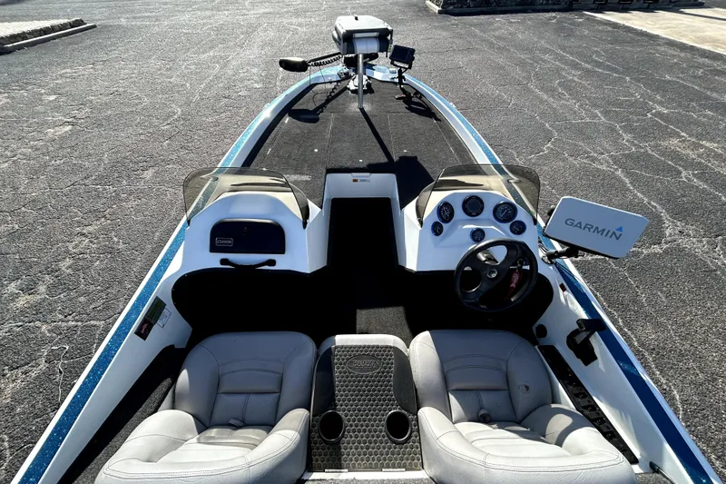 Slide: The Image of 2003 Champion 187 CX boat interior with Garmin navigation system and dual seating. - 7