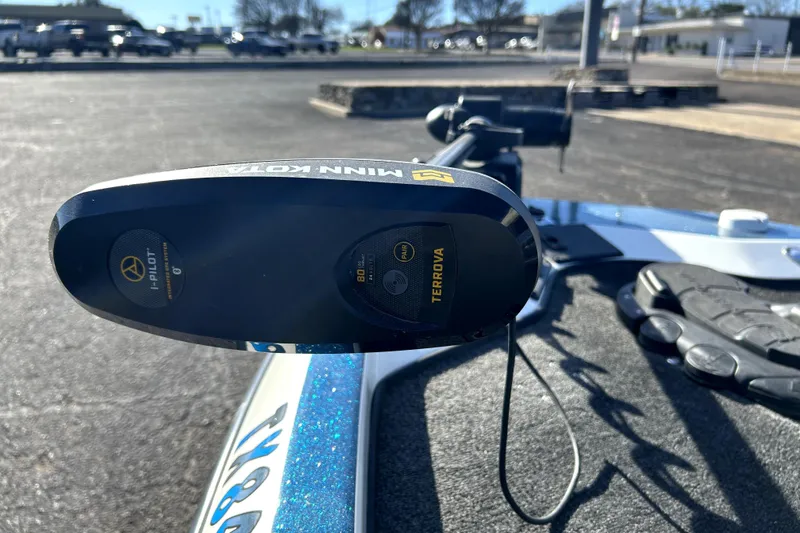 Slide: The Image of Minn Kota Terrova motor on 2003 Champion 187 CX boat, parked in sunny lot. - 8