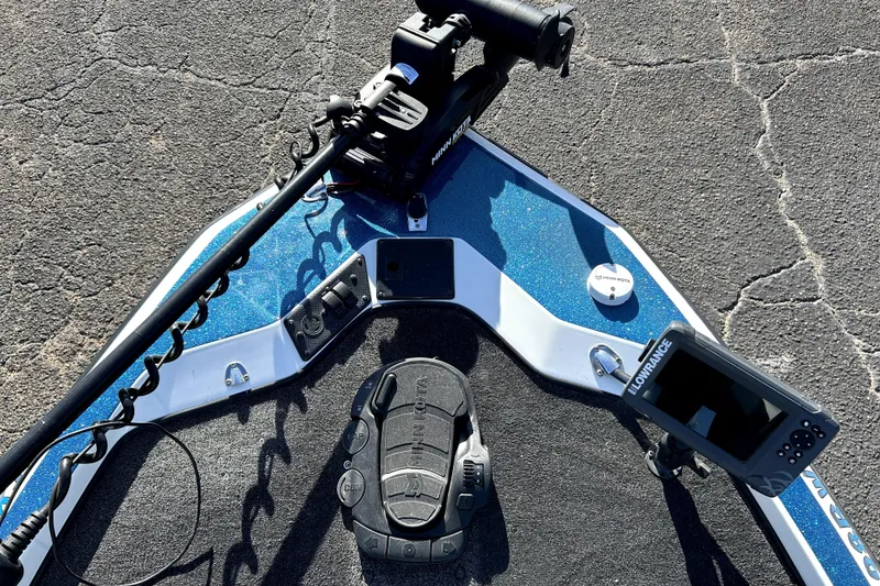 Slide: The Image of 2003 Champion 187 CX boat deck with trolling motor and fish finder. - 9