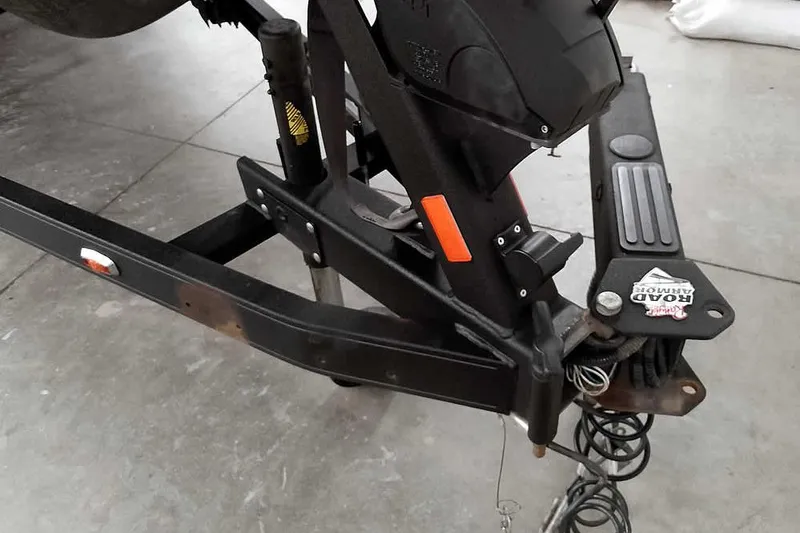 Slide: The Image of 2021 Ranger Z520L boat trailer hitch with Road Armor system in a garage setting. - 24