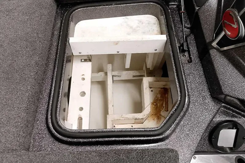 Slide: The Image of Open storage compartment in 2021 Ranger Z520L boat, showing interior structure. - 39