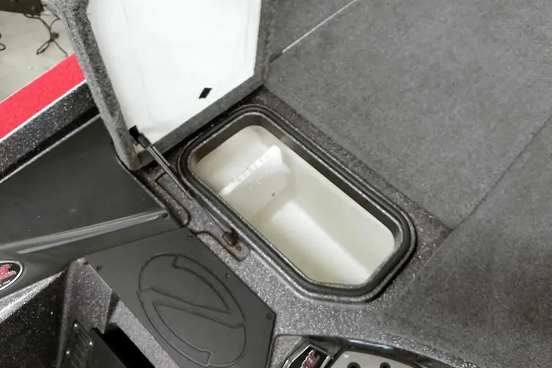 Slide: The Image of 2021 Ranger Z520L boat storage compartment with open lid, showcasing interior space. - 41