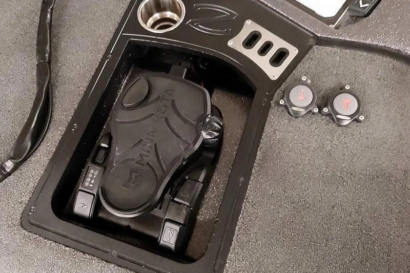 Slide: The Image of 2021 Ranger Z520L boat foot pedal and controls on deck. - 46