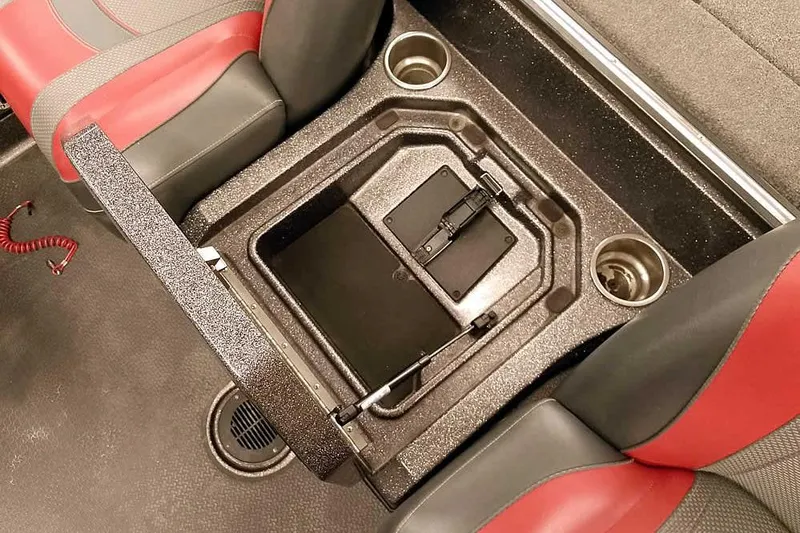 Slide: The Image of 2021 Ranger Z520L boat interior with storage compartment and cup holders. - 48