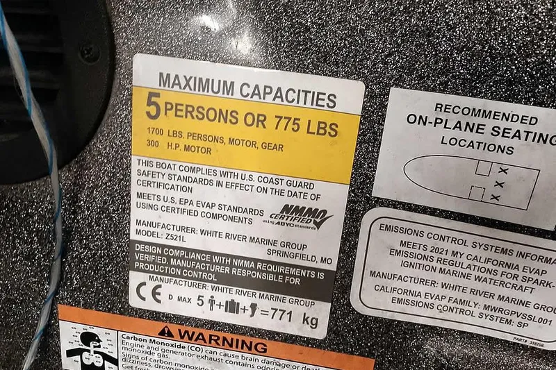 Slide: The Image of 2021 Ranger Z520L capacity label, 5 persons or 775 lbs, safety compliance details. - 51