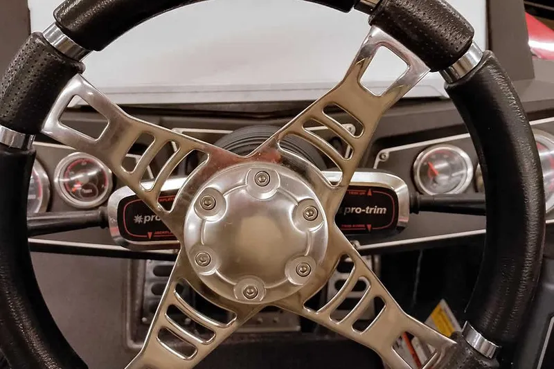 Slide: The Image of Steering wheel of 2021 Ranger Z520L boat with dashboard gauges and controls. - 54