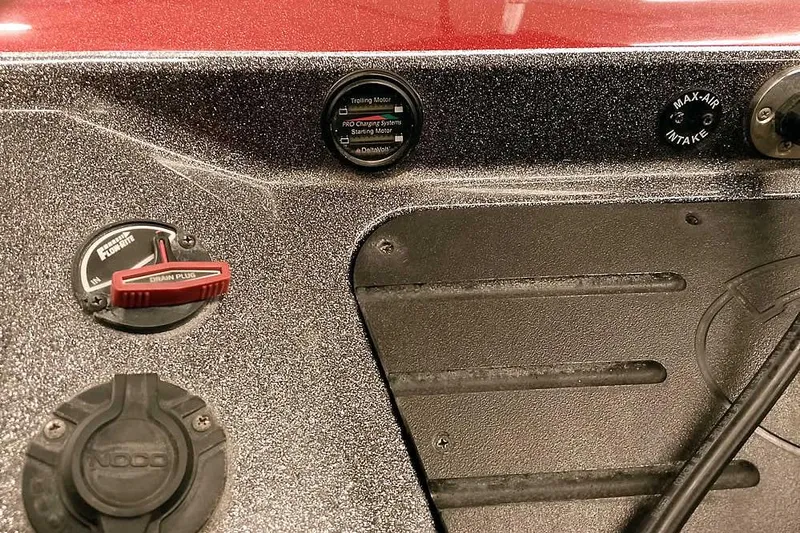 Slide: The Image of 2021 Ranger Z520L boat dashboard with controls and gauges, featuring a trolling motor and drain plug. - 62