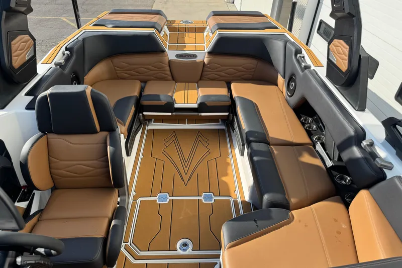 Slide: The Image of 2026 Supra SV 575 boat interior with luxurious tan and black seating. - 5