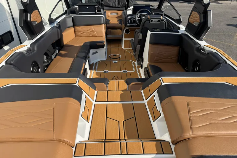 Slide: The Image of Luxurious interior of 2026 Supra SV 575 boat with tan and black seating. - 6