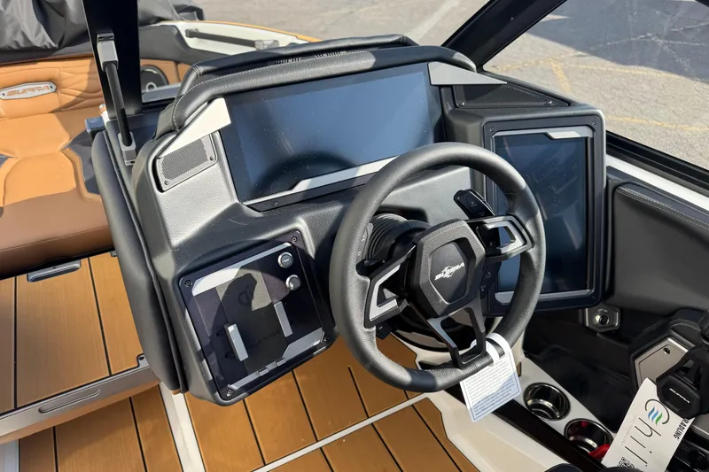 Slide: The Image of 2026 Supra SV 575 boat dashboard with modern steering wheel and digital displays. - 7