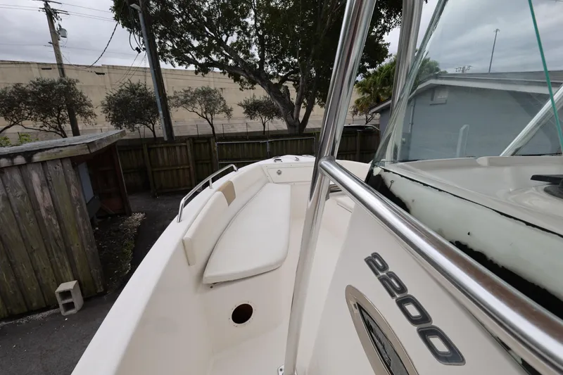 Slide: The Image of 2018 Century 2200 Center Console boat, side view with railing and seating. - 15