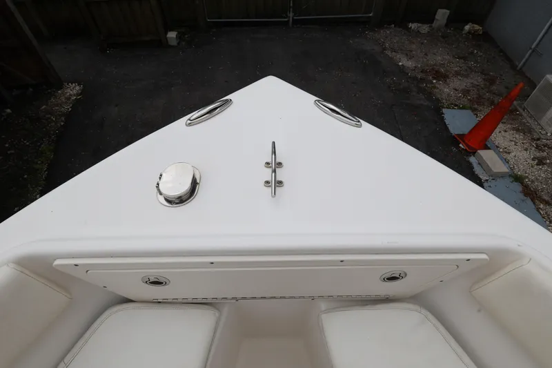 Slide: The Image of Bow of a 2018 Century 2200 Center Console boat, parked on a driveway. - 17