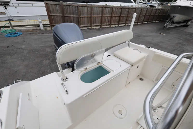 Slide: The Image of 2018 Century 2200 Center Console boat interior with seating and storage compartments. - 22