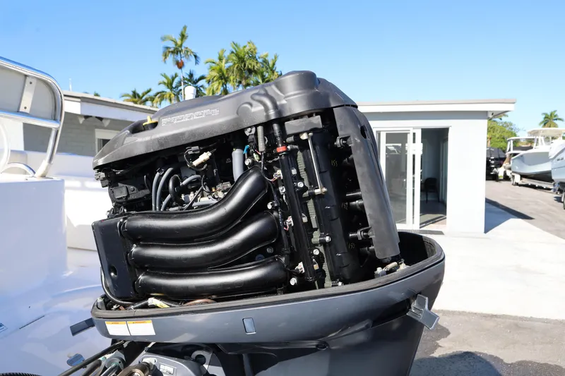 Slide: The Image of 2018 Century 2200 Center Console boat engine, detailed view, outdoors. - 24