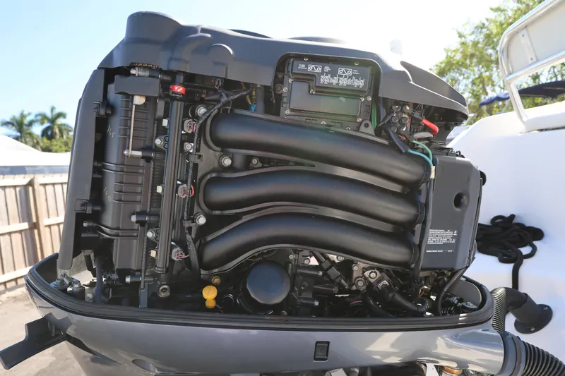Slide: The Image of Close-up of a 2018 Century 2200 Center Console boat engine, showcasing intricate components. - 25